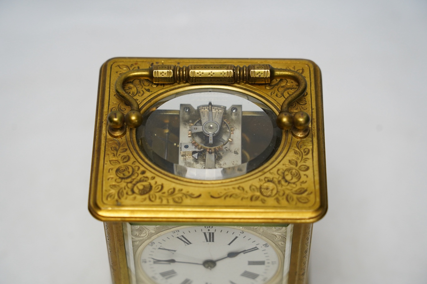 An engraved brass carriage clock by Richard & Cie, serial number 648, with key, 14cm. Condition - fair, dial cracked. Not tested as working